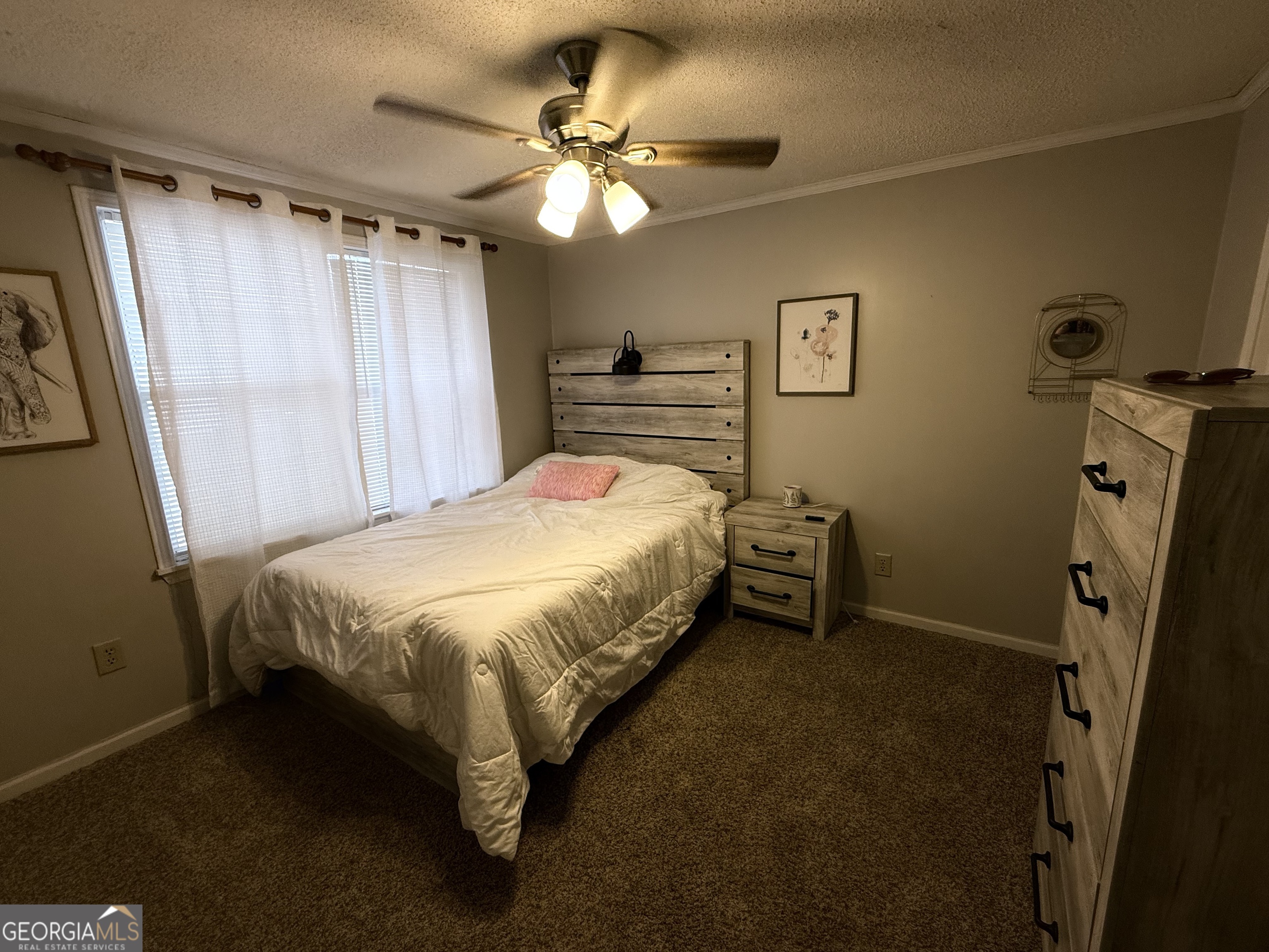 931 Shelor Ferry Road Fair Play, SC 29643 - Photo 17 of 26 a bedroom with a bed and a flat tv screen on the dresser