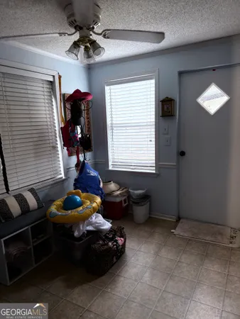 a bedroom with furniture and a window