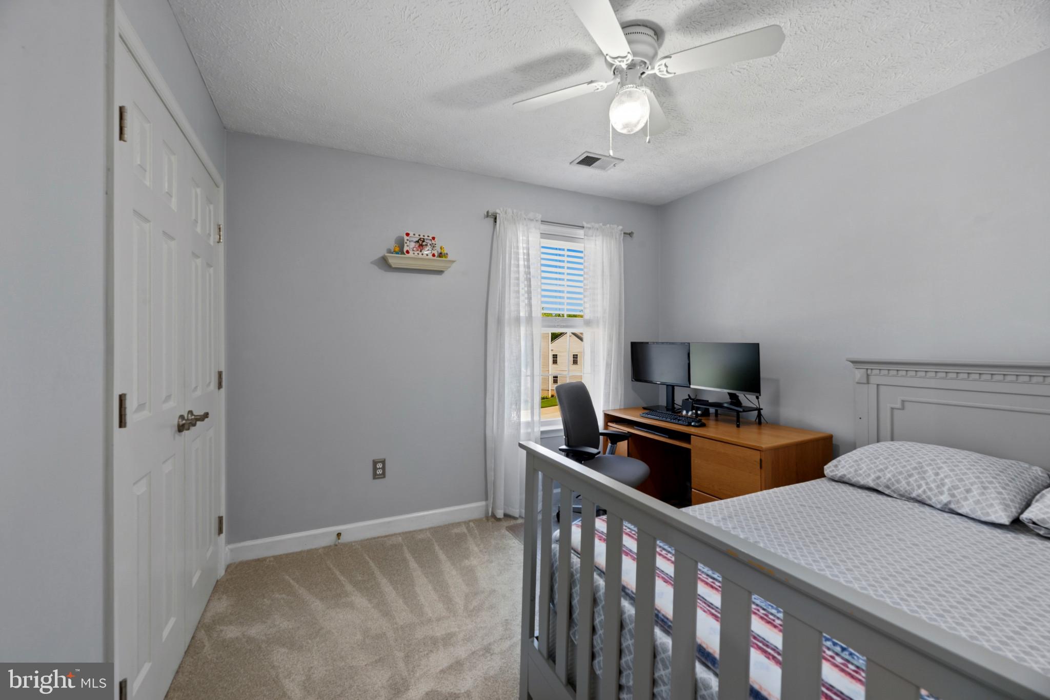 6330 Hanover Crossing Way Hanover, MD 21076 - Photo 13 of 32 a bedroom with a bed and a chandelier