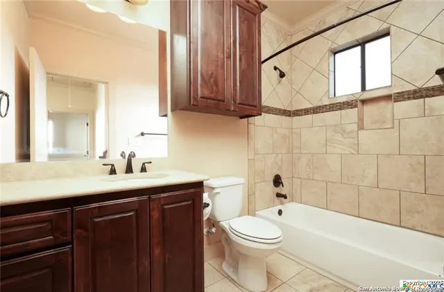 a bathroom with a sink a toilet and bathtub
