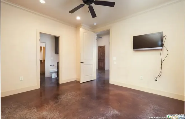a view of an empty room with a bathroom