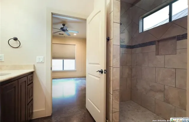 a bathroom with a sink and mirror