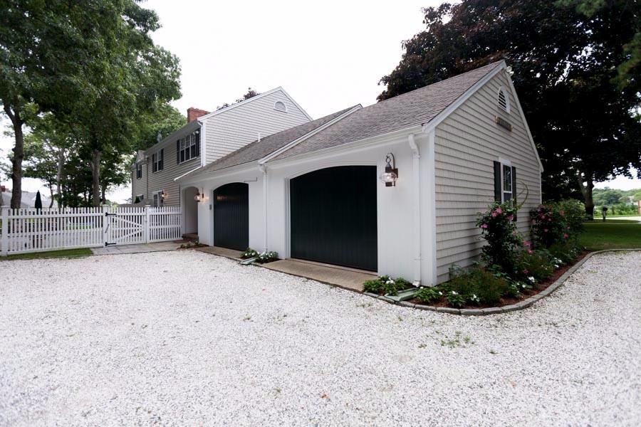 14 Bayview Road Osterville, MA 02655 - Photo 31 of 32 a view of a house with a yard and garage