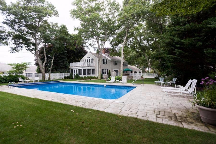 14 Bayview Road Osterville, MA 02655 - Photo 4 of 32 a front view of house with yard and outdoor seating
