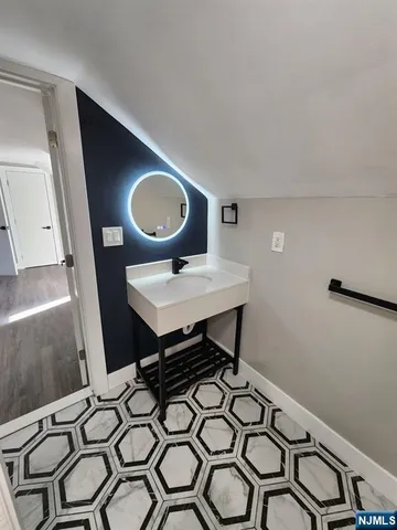 a living room with furniture and a rug