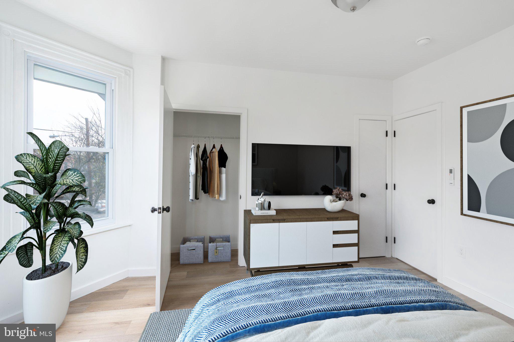5758 Spruce Street, Unit 2 Philadelphia, PA 19139 - Photo 12 of 25 Modern serenity in a bright bedroom.