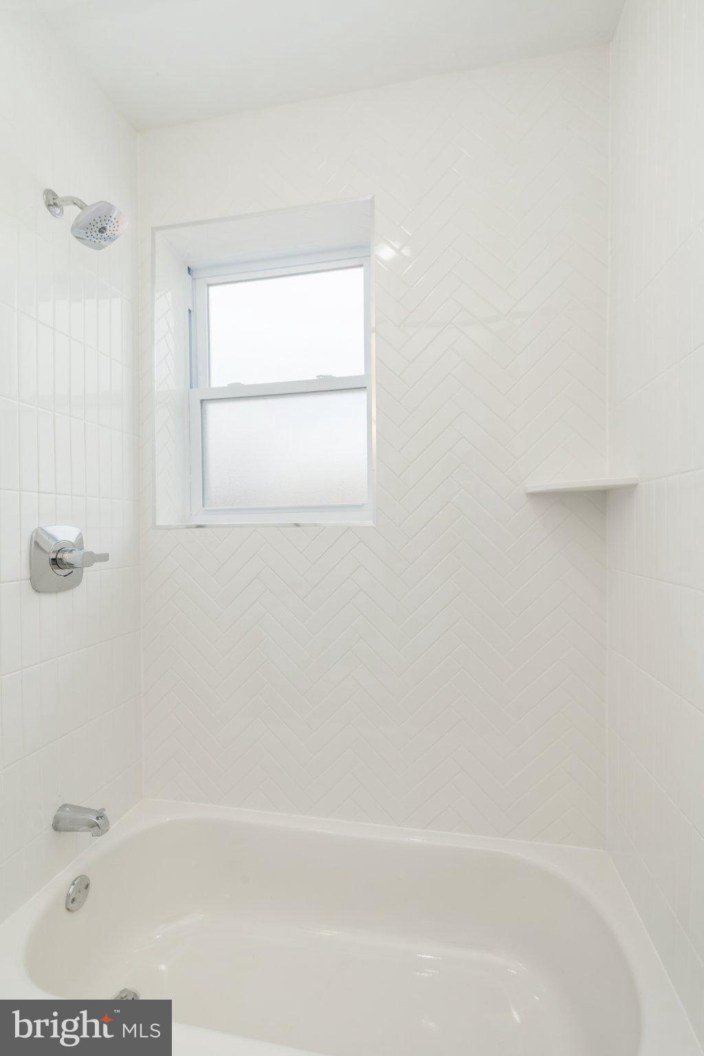 5758 Spruce Street, Unit 2 Philadelphia, PA 19139 - Photo 15 of 25 Bright and airy bathroom retreat.