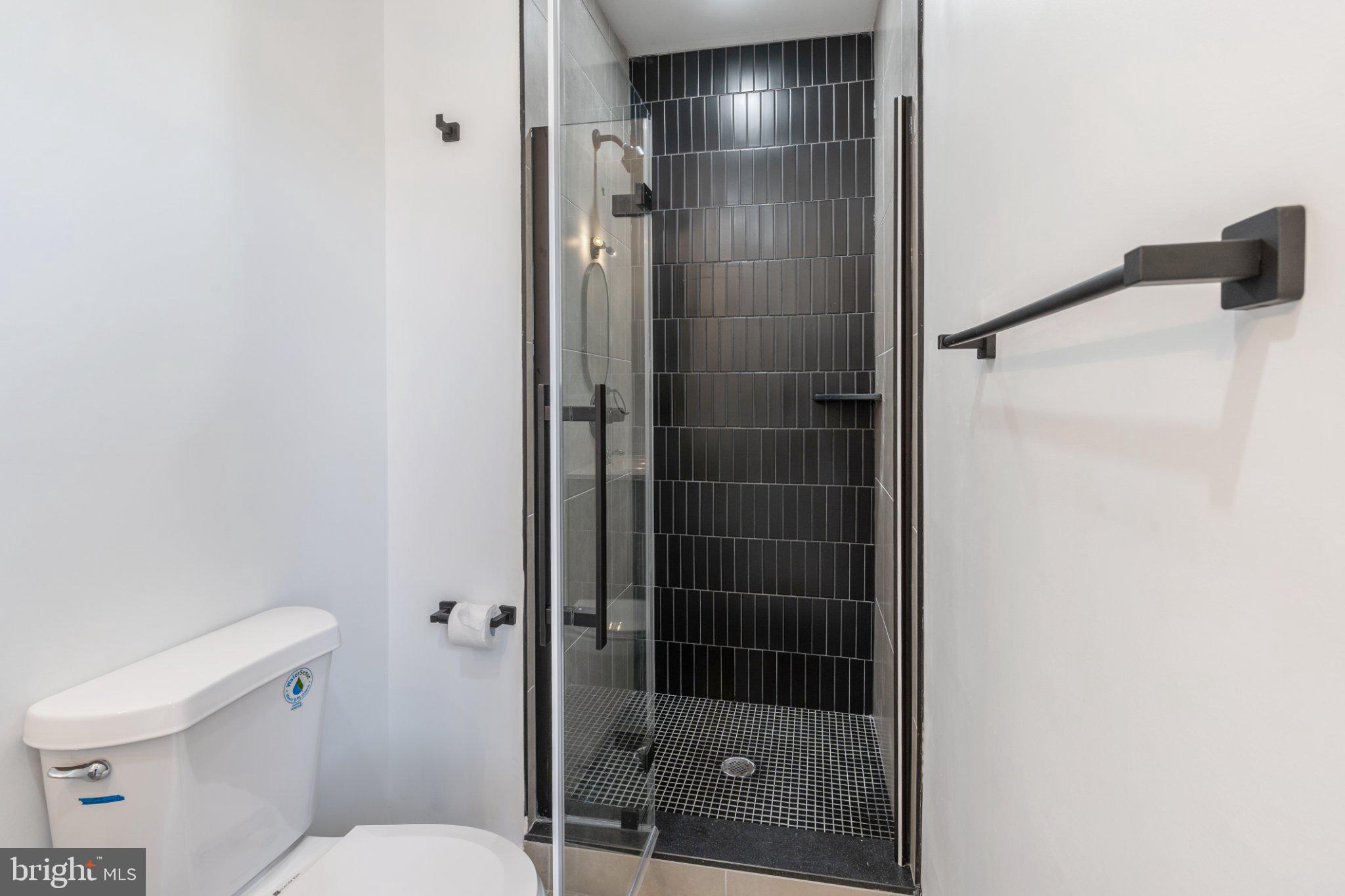 5758 Spruce Street, Unit 2 Philadelphia, PA 19139 - Photo 20 of 25 Sleek modern bathroom with stylish tiles.