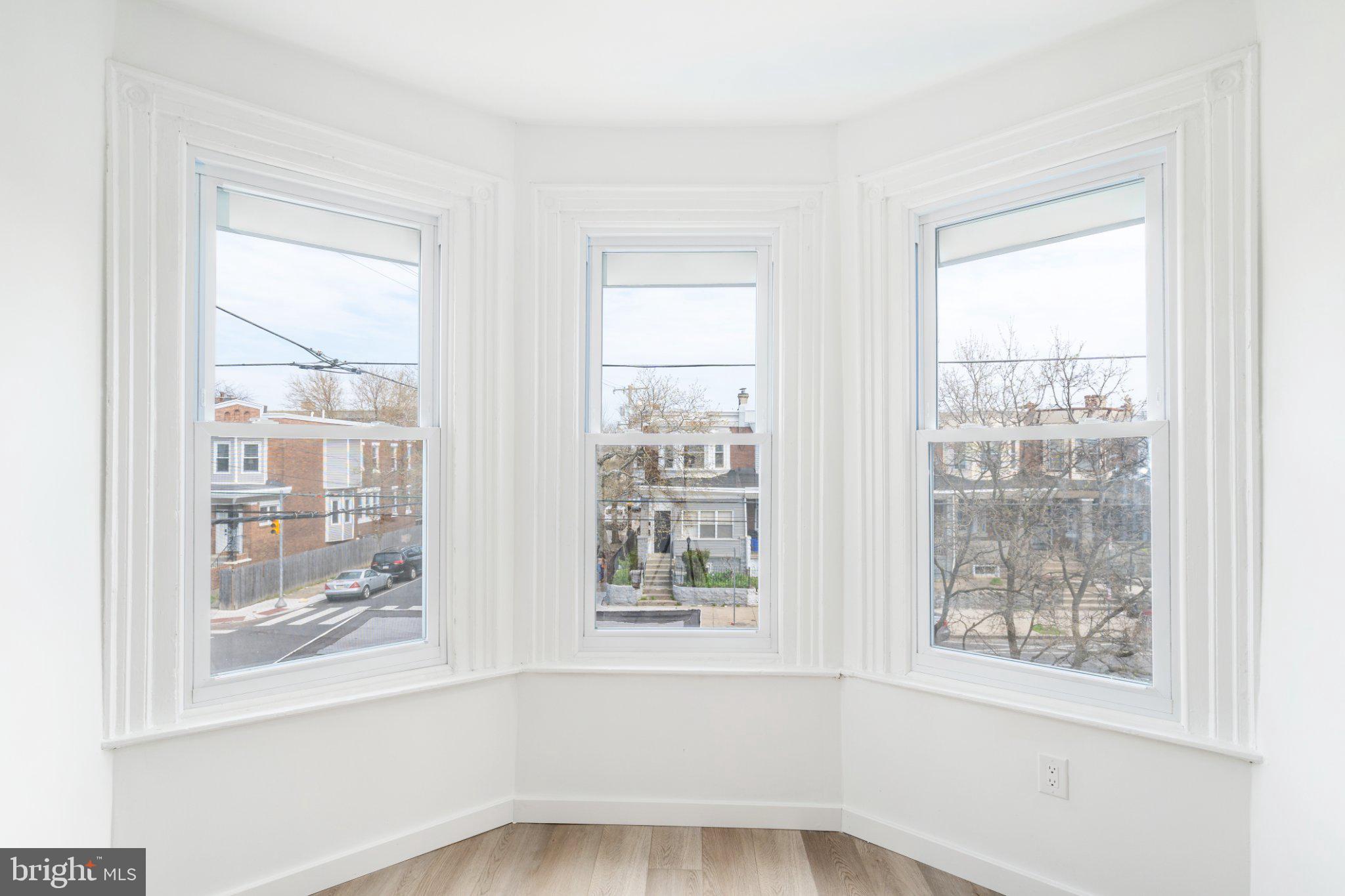 5758 Spruce Street, Unit 2 Philadelphia, PA 19139 - Photo 23 of 25 Bright bay windows with a city view.