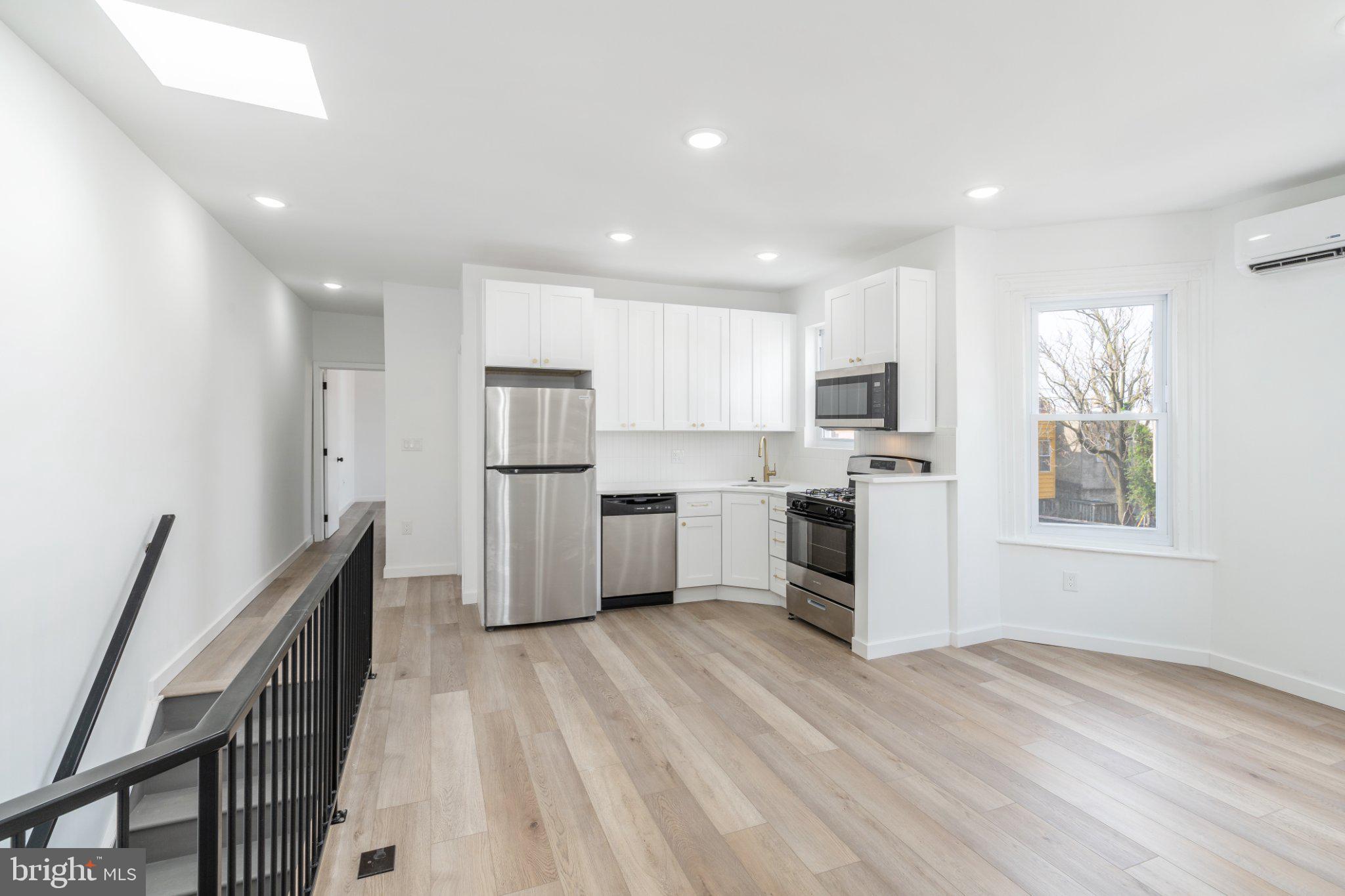 5758 Spruce Street, Unit 2 Philadelphia, PA 19139 - Photo 6 of 25 Modern kitchen with natural light.