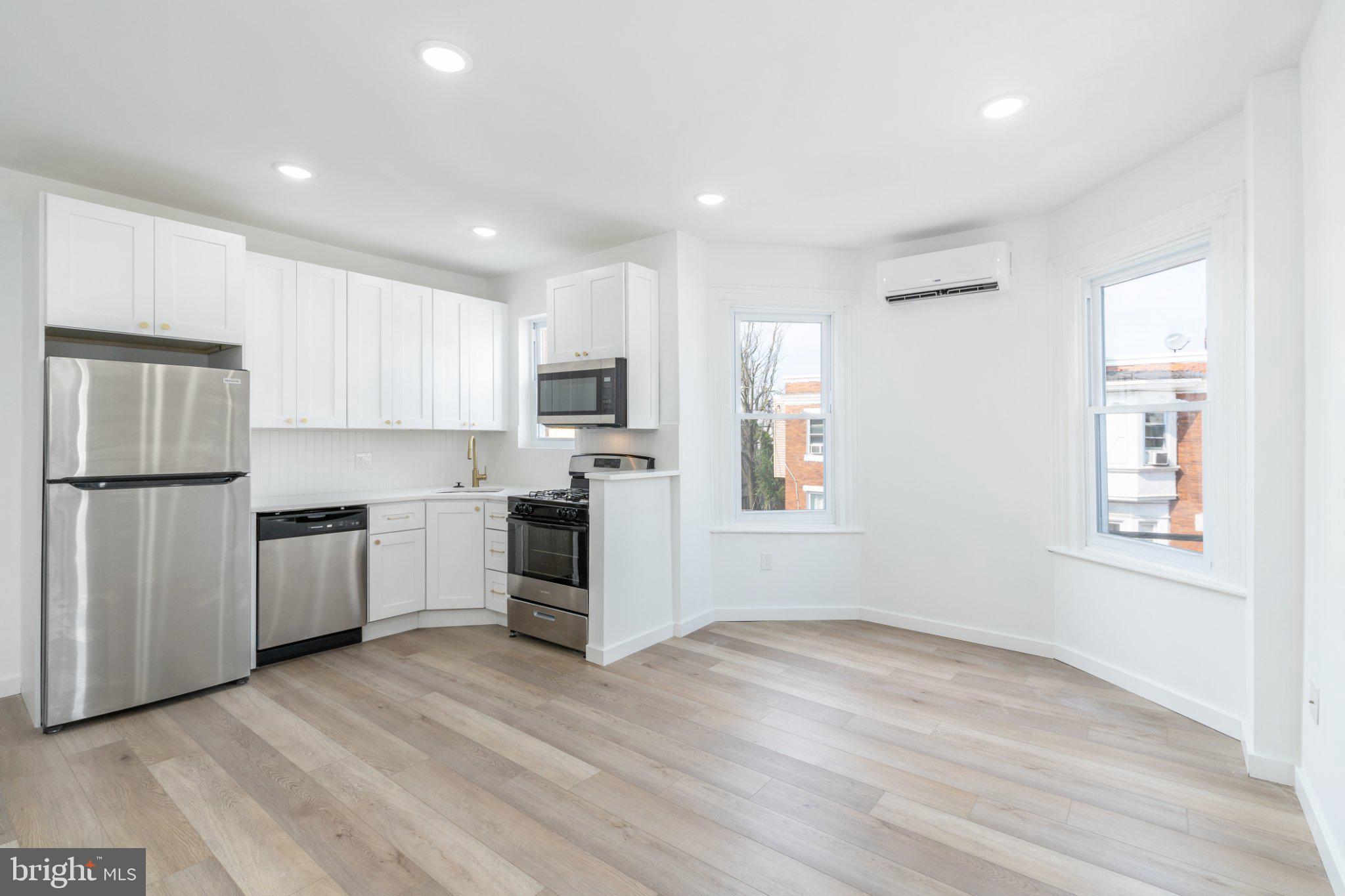 5758 Spruce Street, Unit 2 Philadelphia, PA 19139 - Photo 7 of 25 Bright and airy modern kitchen space.