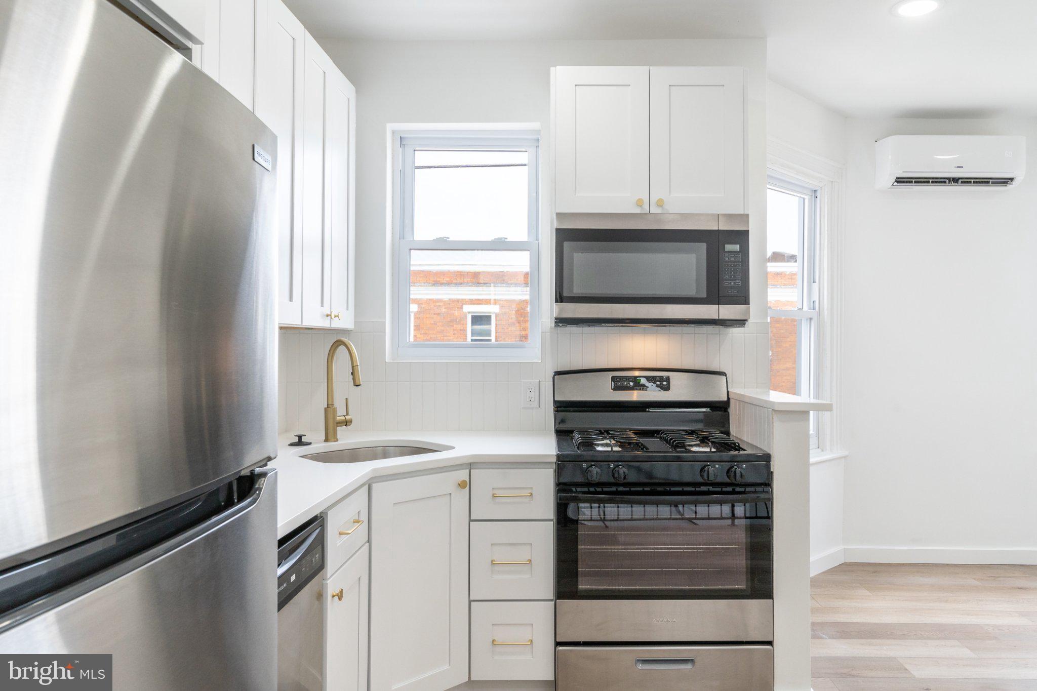 5758 Spruce Street, Unit 2 Philadelphia, PA 19139 - Photo 10 of 25 Modern kitchen with sleek appliances.