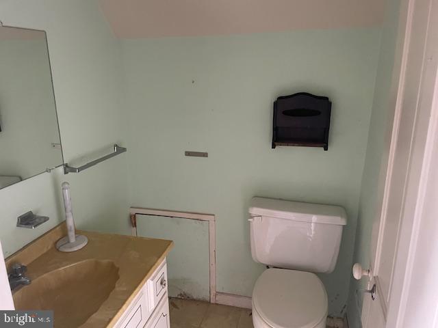 5733 Coventry Parish Road Westover, MD 21871 - Photo 19 of 27 a bathroom with a sink a toilet and a mirror