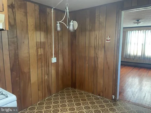 an empty room with wooden floor