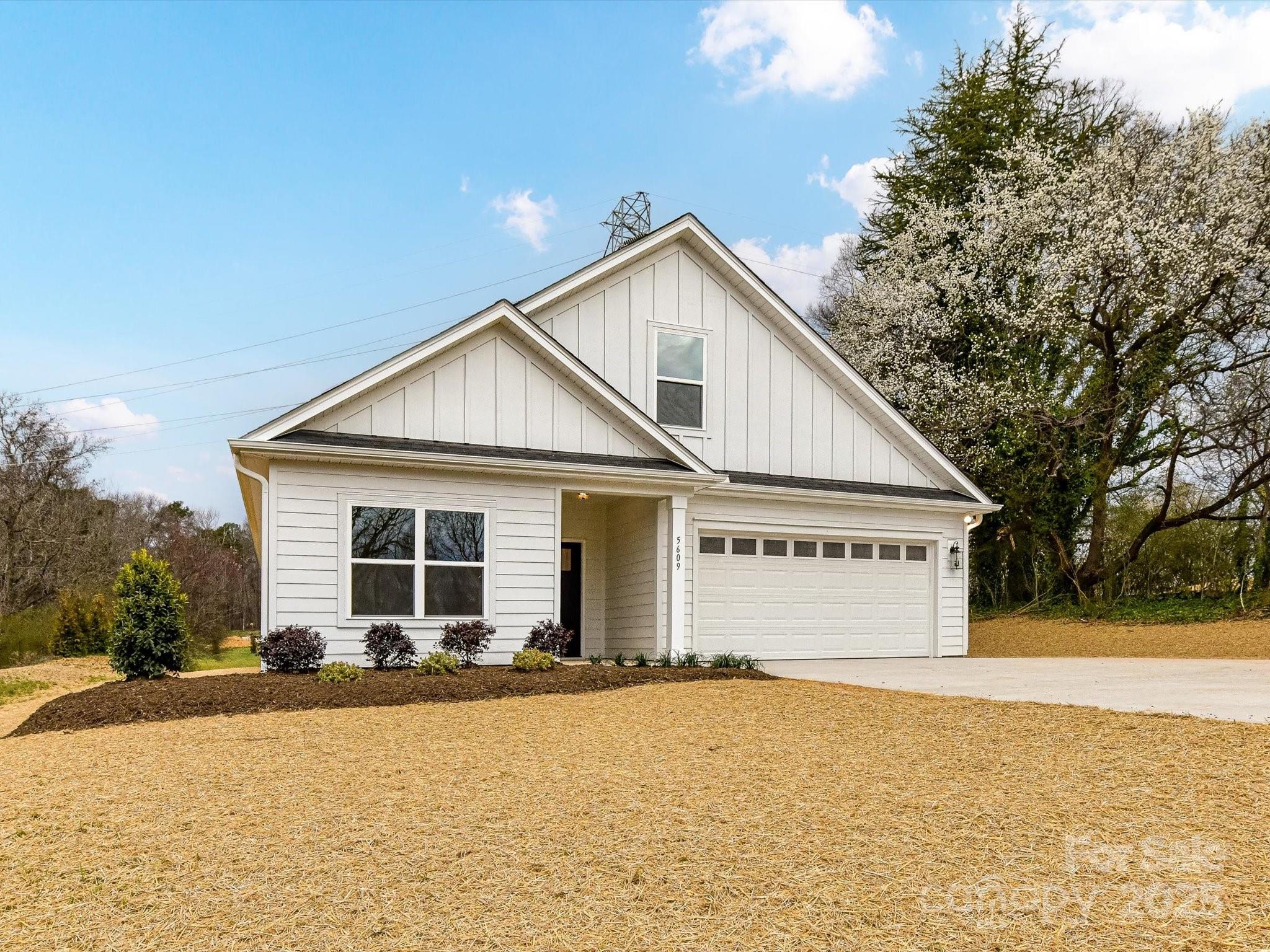 5609 Morgan Mill Road Monroe, NC 28110 - Photo 1 of 22 a view of a house with snow on the road