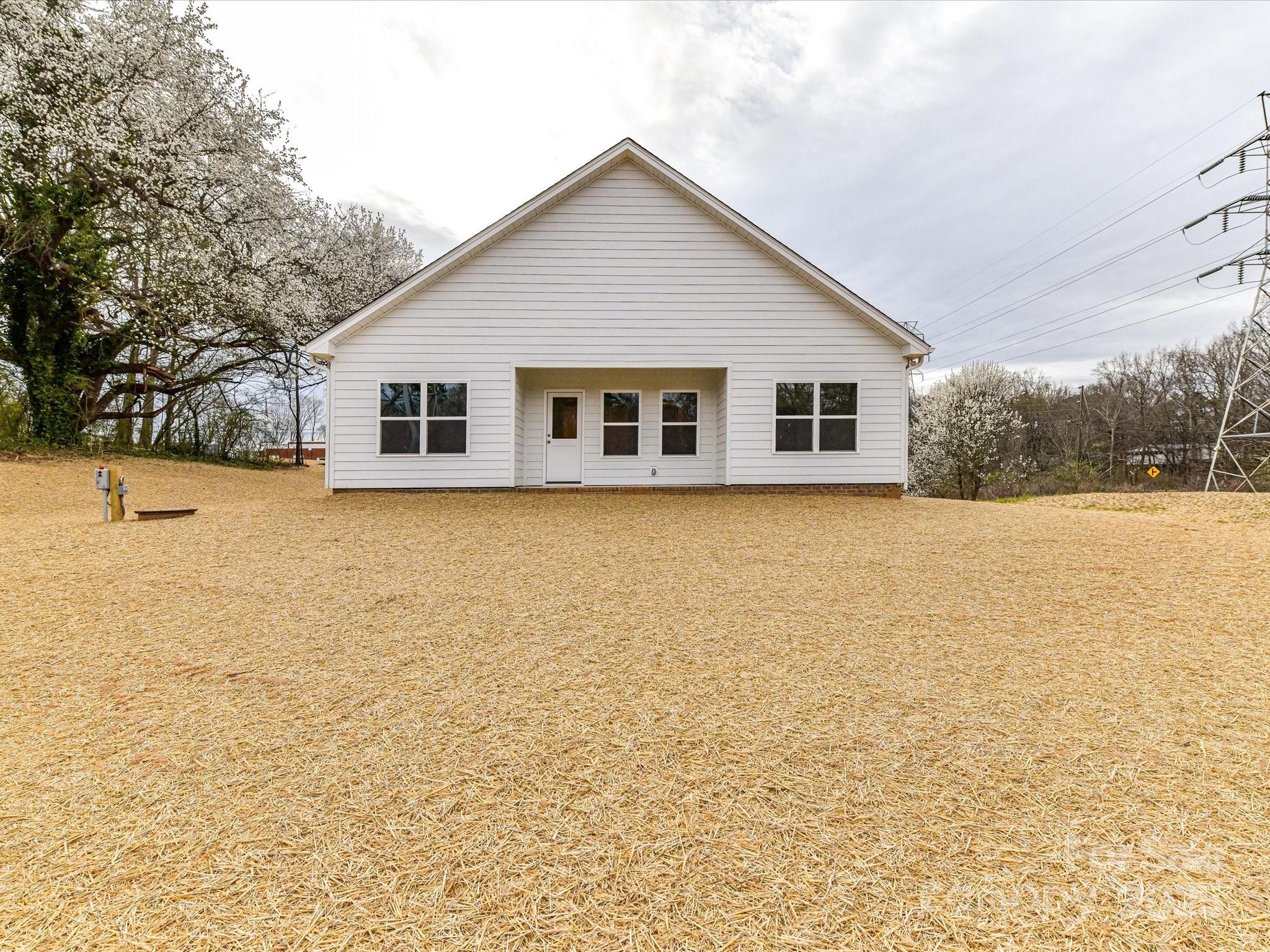 5609 Morgan Mill Road Monroe, NC 28110 - Photo 22 of 22 a view of house with yard and trees in front of it