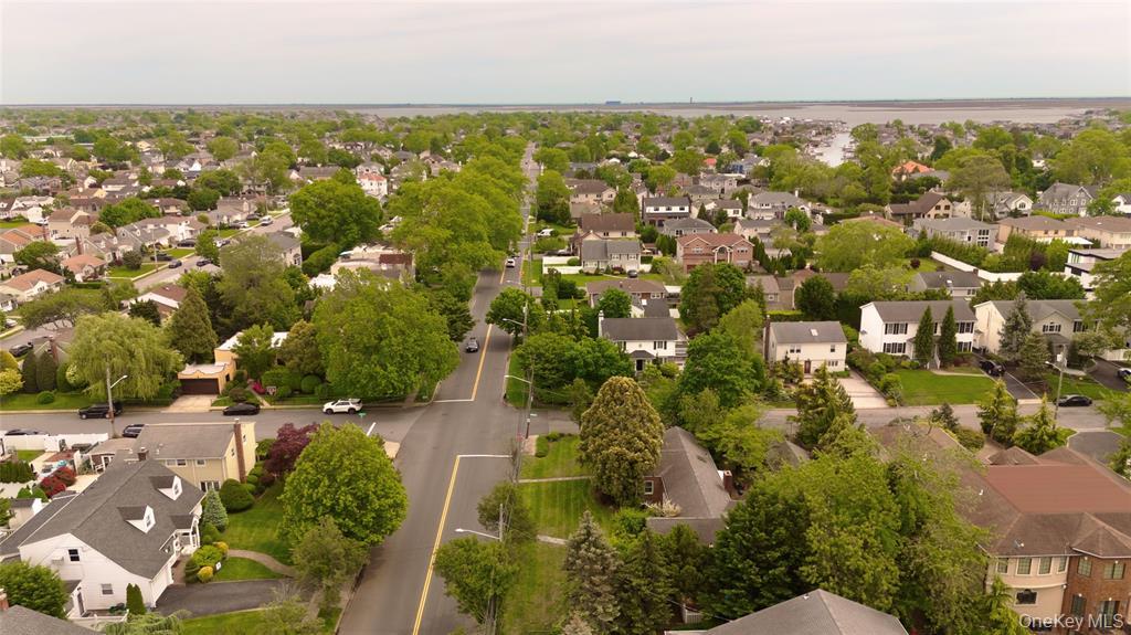 2077 Byron Road Merrick, NY 11566 - Photo 4 of 4 an aerial view of residential houses with outdoor space and trees