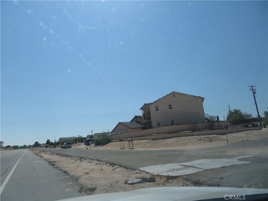 0 Matick Drive Edwards, CA 93523 - Photo 14 of 17 a view of a dry yard with wooden fence