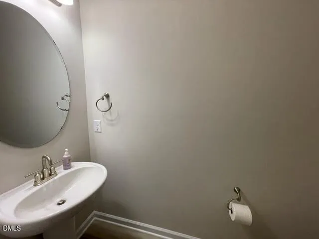 an empty room with closet and mirror