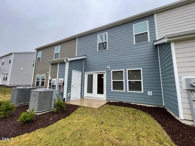 a view of a brick house with many windows