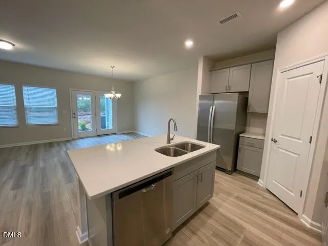 a kitchen with a microwave and a stove