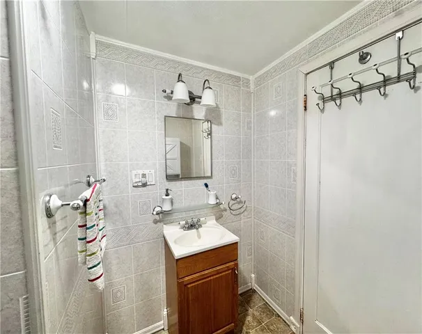 a bathroom with a sink and mirror