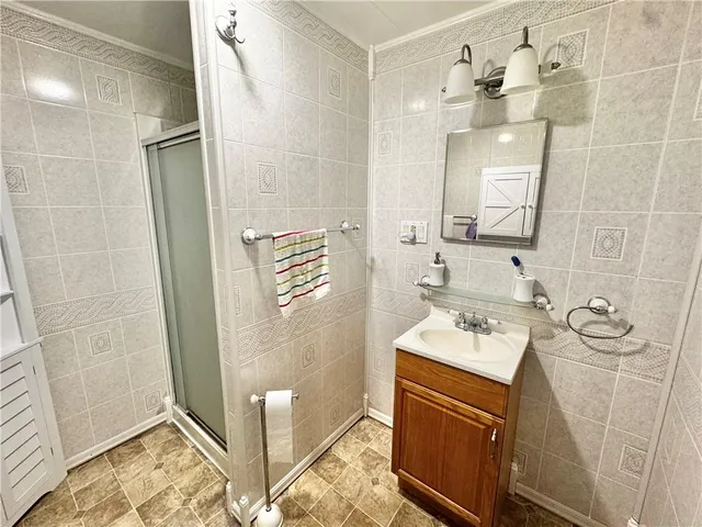 a bathroom with a sink a vanity and a mirror