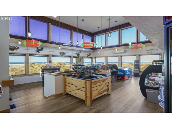a kitchen with stainless steel appliances kitchen island granite countertop a sink and cabinets