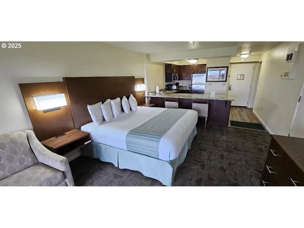 a living room with furniture and a lamp