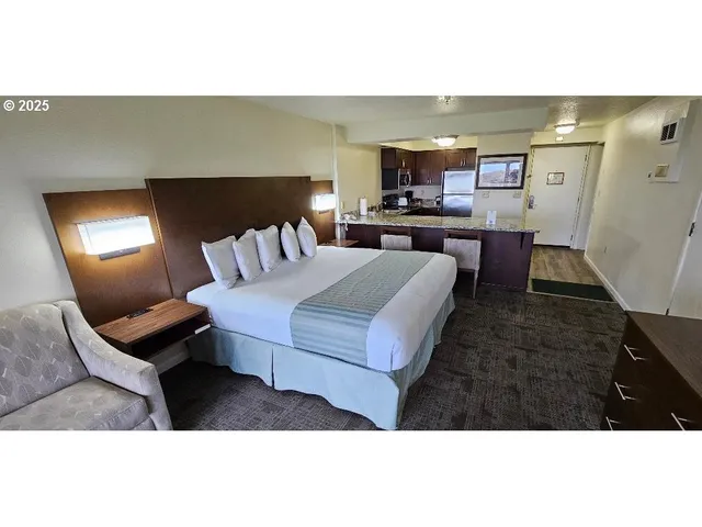 a living room with furniture and a lamp