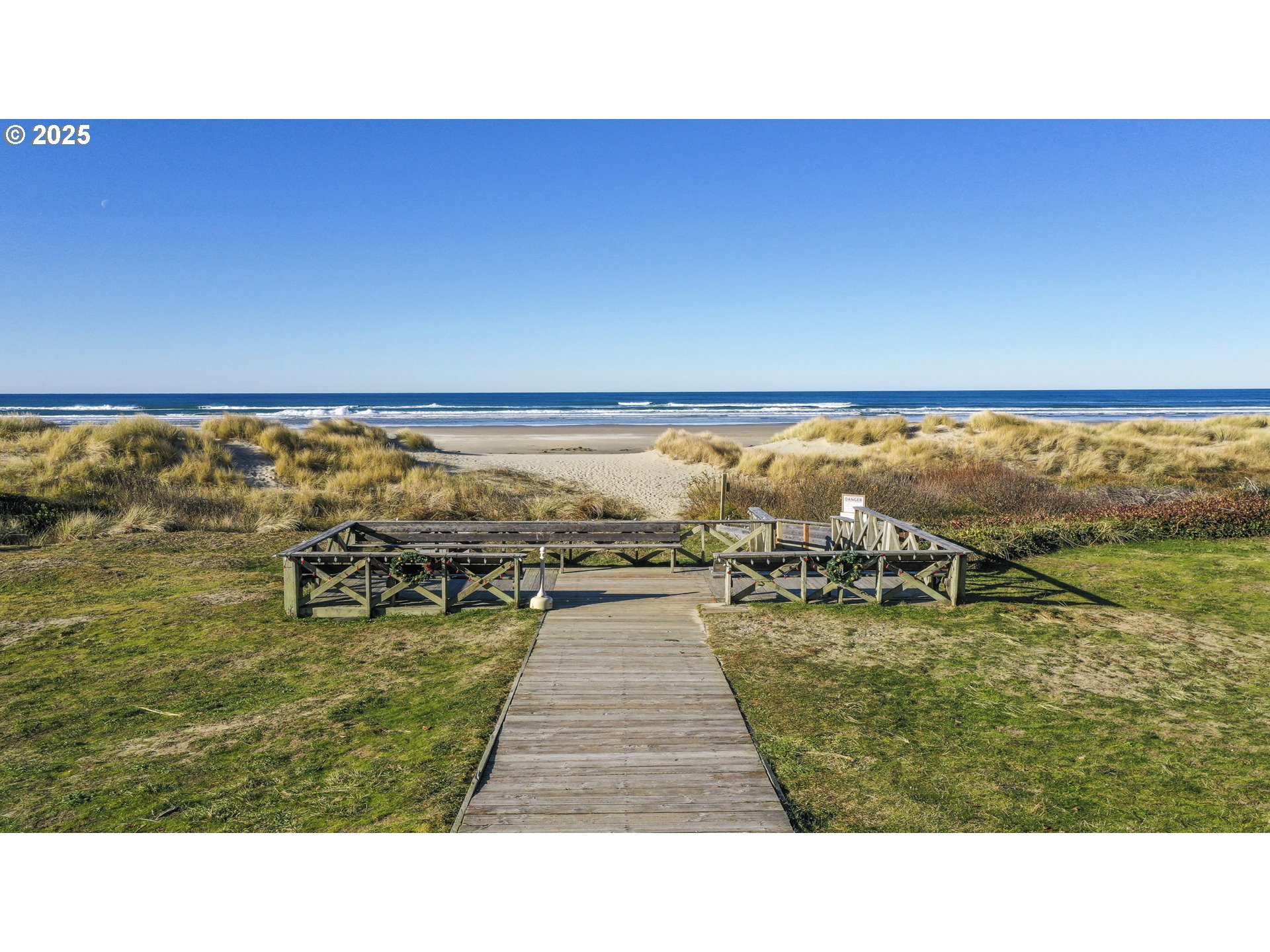 88416 1st Avenue, Unit 101 Florence, OR 97439 - Photo 8 of 24 a open area with lawn chairs and ocean view