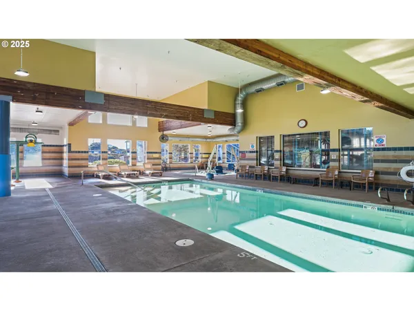 a living room with lots of furniture and a clock