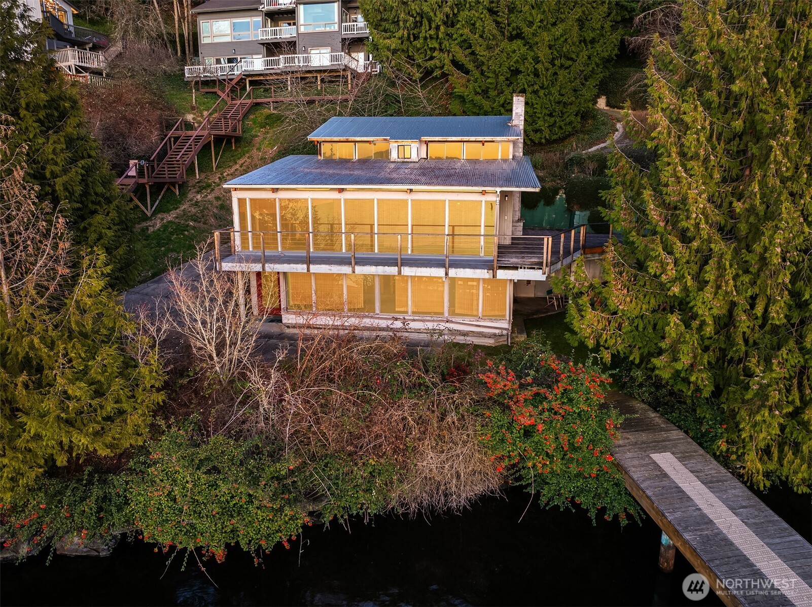 8025 West Mercer Way Mercer Island, WA 98040 - Photo 16 of 36 a sign that is sitting on a brick wall