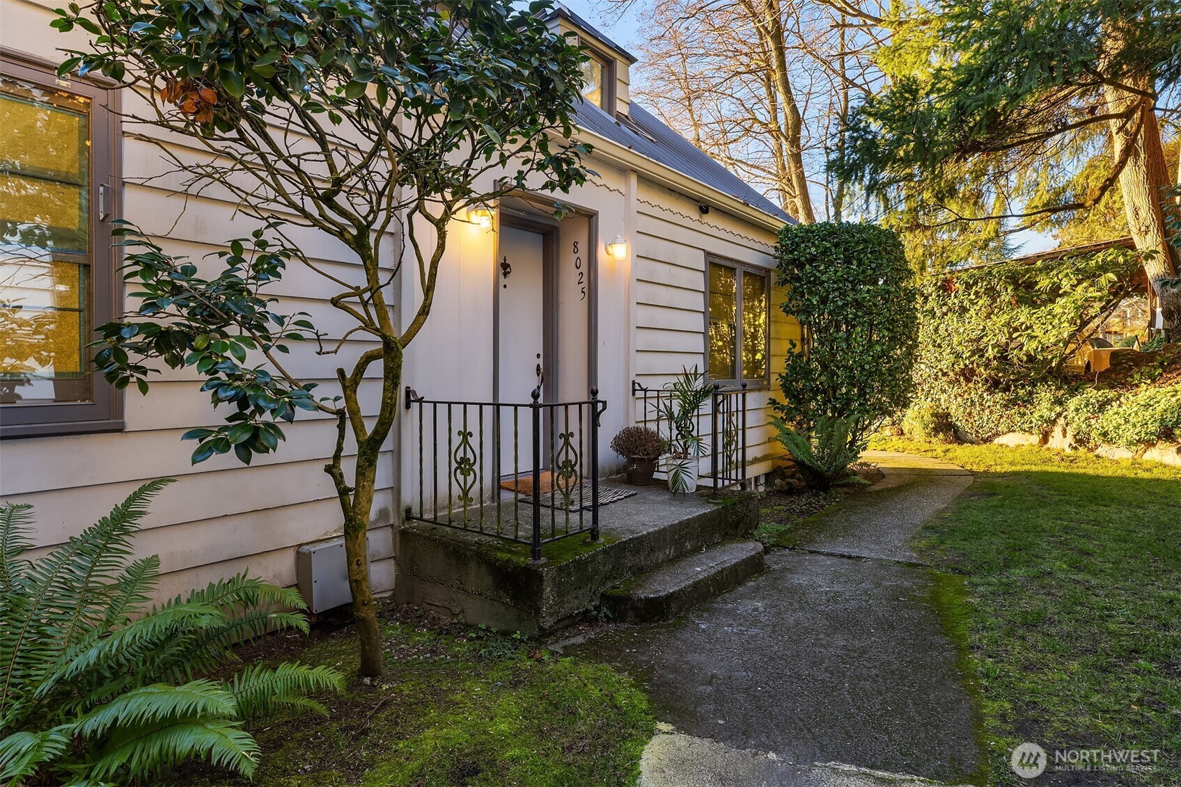 8025 West Mercer Way Mercer Island, WA 98040 - Photo 22 of 36 a view of a house with a yard