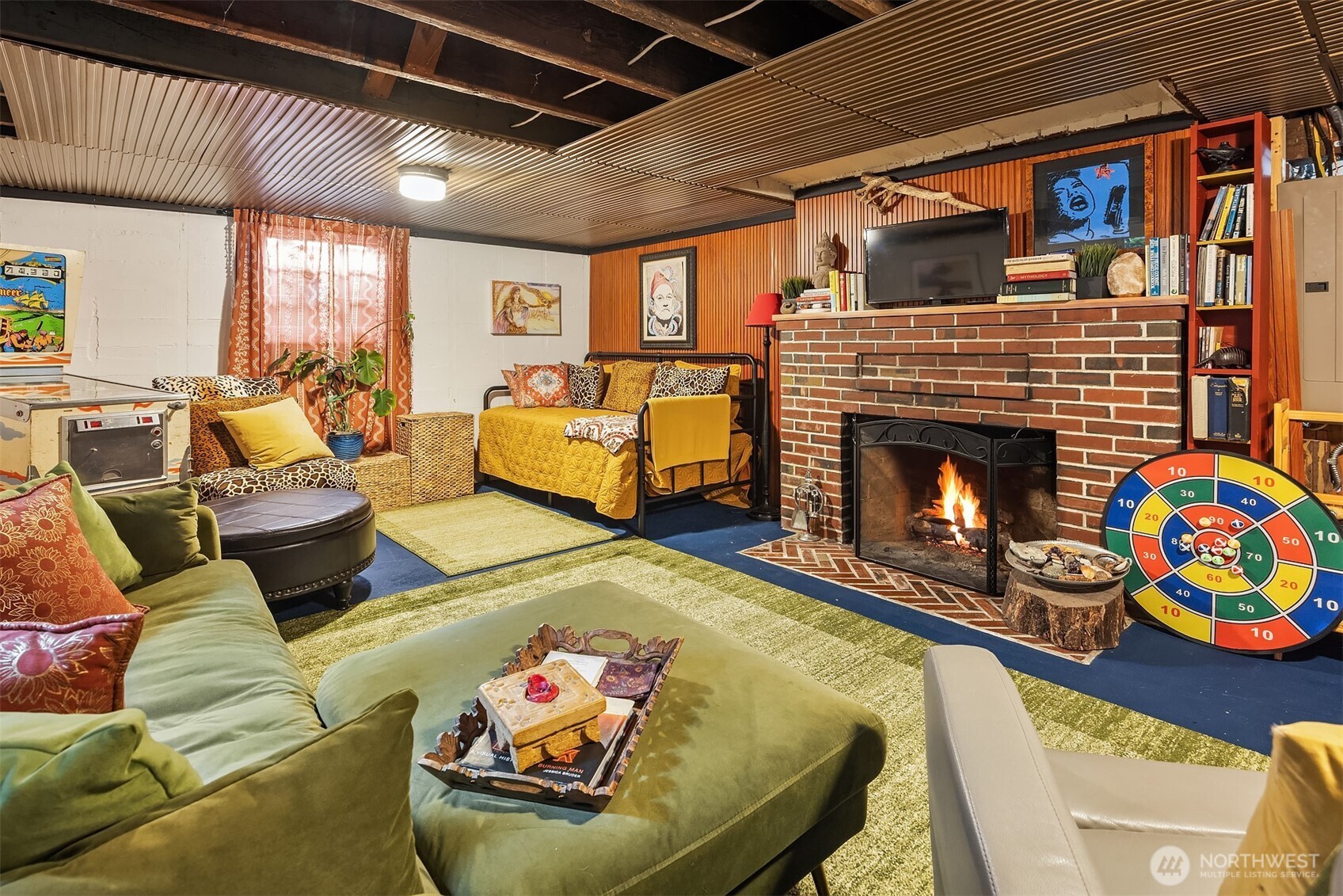 8025 West Mercer Way Mercer Island, WA 98040 - Photo 25 of 36 a living room with furniture and a fireplace