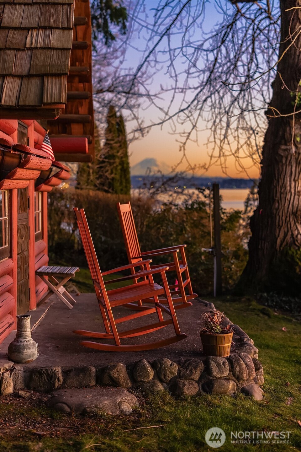 8025 West Mercer Way Mercer Island, WA 98040 - Photo 27 of 36 a view of a patio with table and chairs
