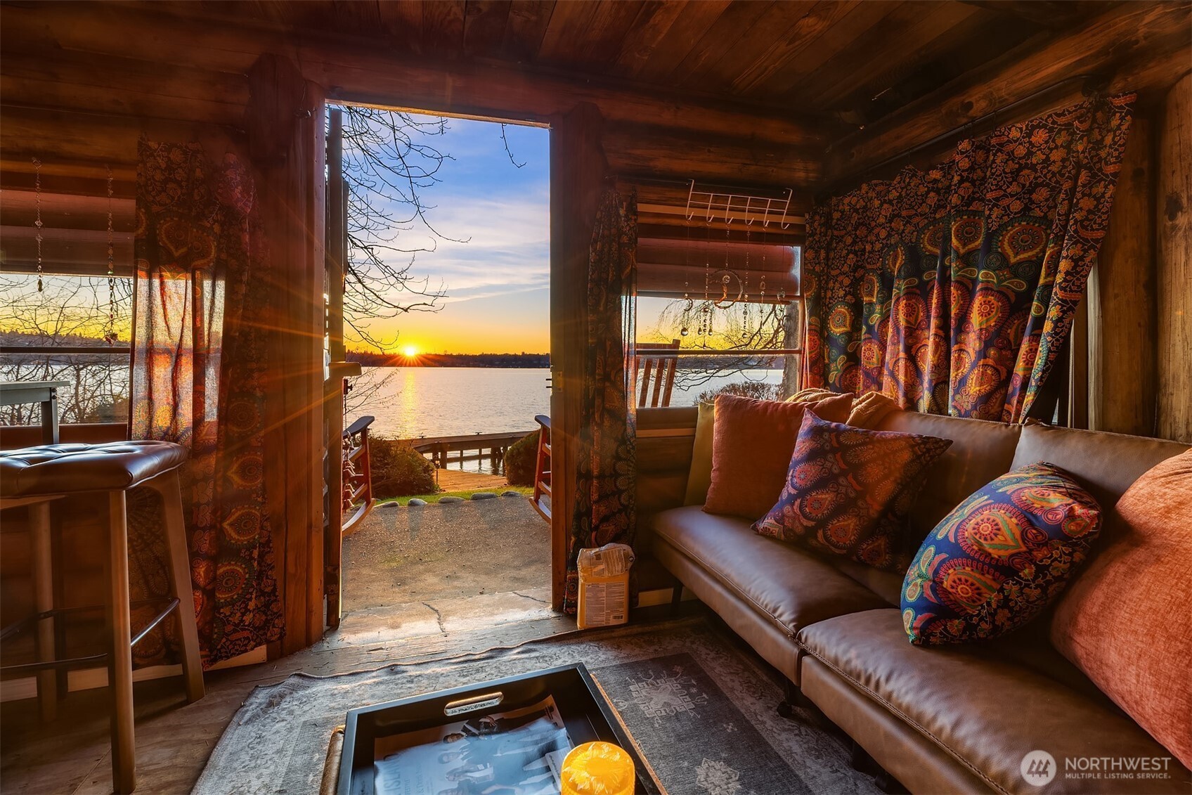 8025 West Mercer Way Mercer Island, WA 98040 - Photo 28 of 36 a living room with furniture and a flat screen tv