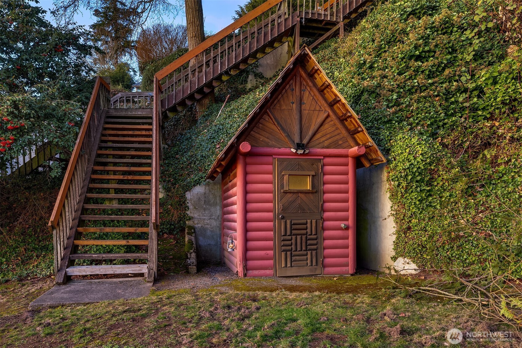 8025 West Mercer Way Mercer Island, WA 98040 - Photo 30 of 36 a front view of a house with a yard