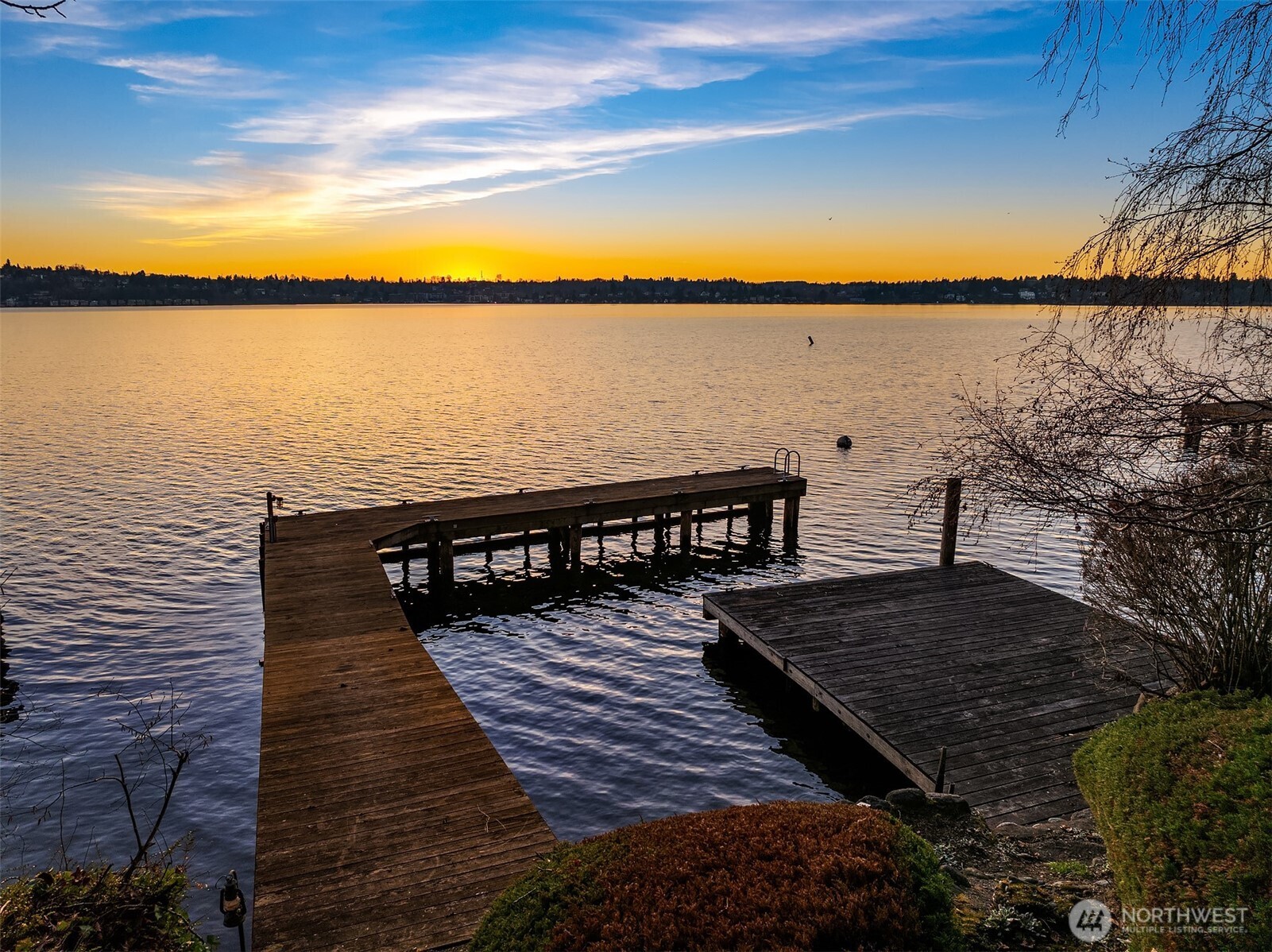 8025 West Mercer Way Mercer Island, WA 98040 - Photo 31 of 36 a view of a balcony with wooden floor and lake view