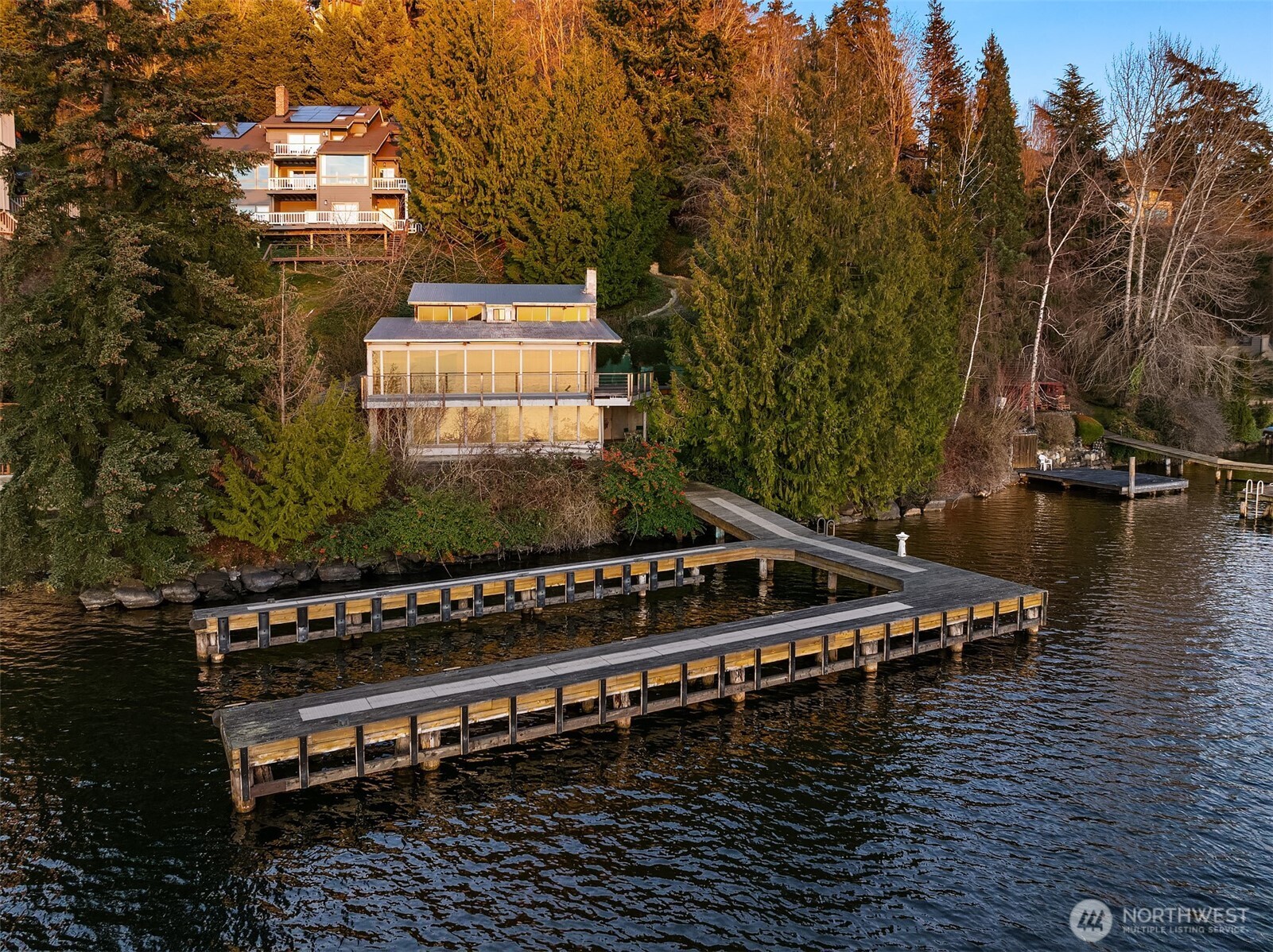 8025 West Mercer Way Mercer Island, WA 98040 - Photo 5 of 36 a view of a balcony with chairs and wooden fence