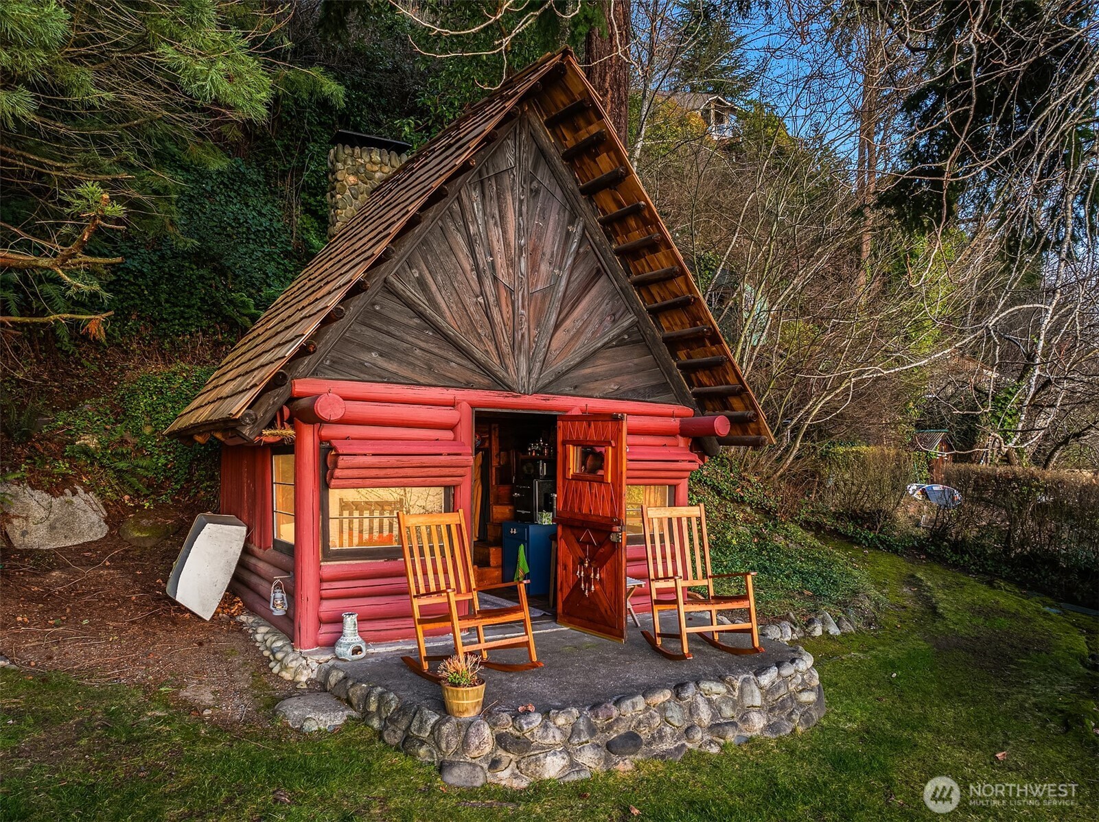 8025 West Mercer Way Mercer Island, WA 98040 - Photo 7 of 36 a view of a house with a yard