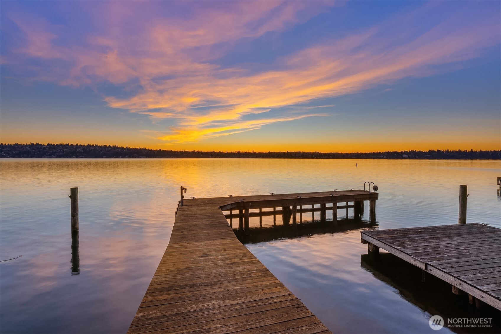 8025 West Mercer Way Mercer Island, WA 98040 - Photo 9 of 36 a view of wooden floor with a lake