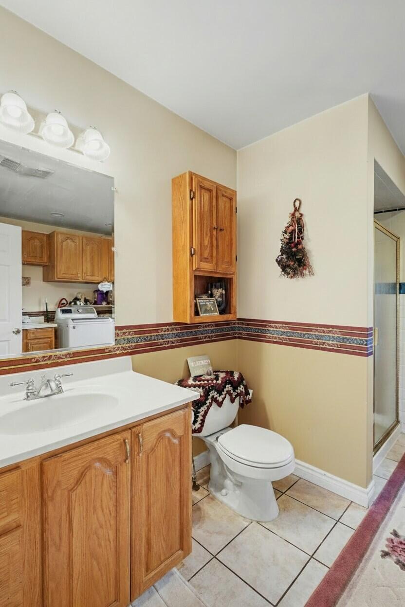 10044 West Sargent Road Fowlerville, MI 48836 - Photo 22 of 37 laundry bath edited
