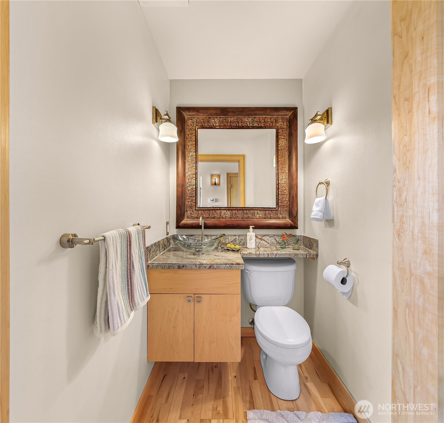 106 North State Street Bellingham, WA 98225 - Photo 19 of 34 a bathroom with a granite countertop toilet sink and mirror