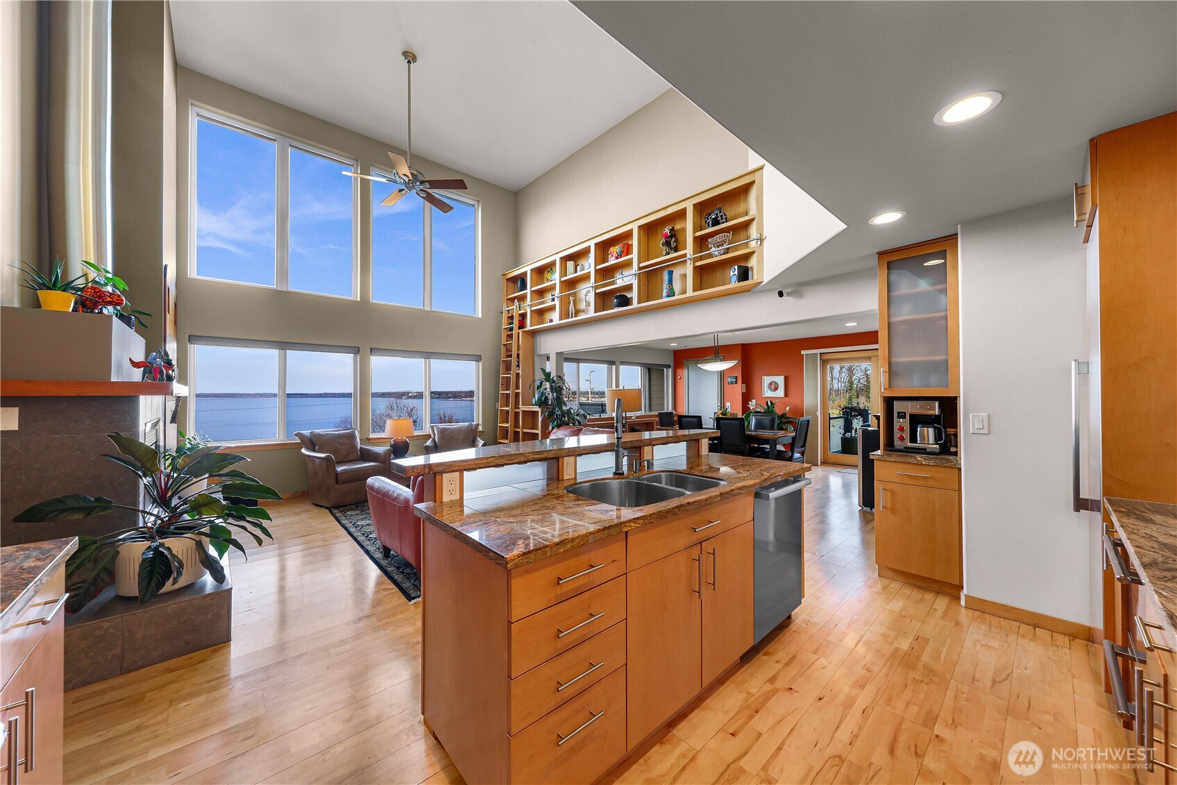 106 North State Street Bellingham, WA 98225 - Photo 9 of 34 a kitchen with stainless steel appliances granite countertop a sink counter space cabinets and wooden floor