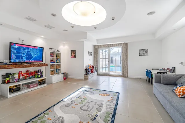 a living room with furniture and window