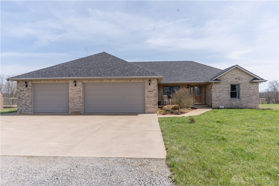 5264 Frazier-Guy Road Sidney, OH 45365 - Photo 3 of 51 This ranch-style home features an attached garage, offering both comfort and convenience.