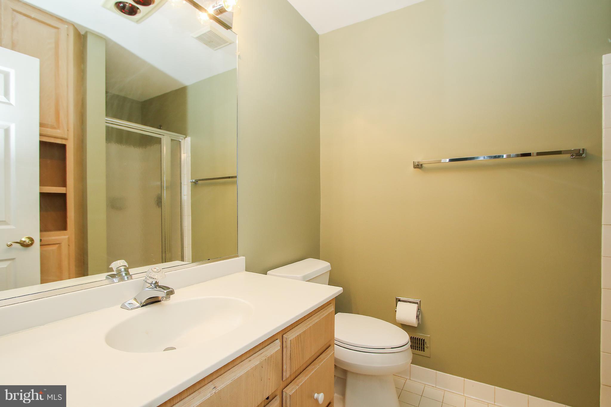 7900 Quarry Ridge Way Bethesda, MD 20817 - Photo 23 of 30 a bathroom with a sink a toilet and shower