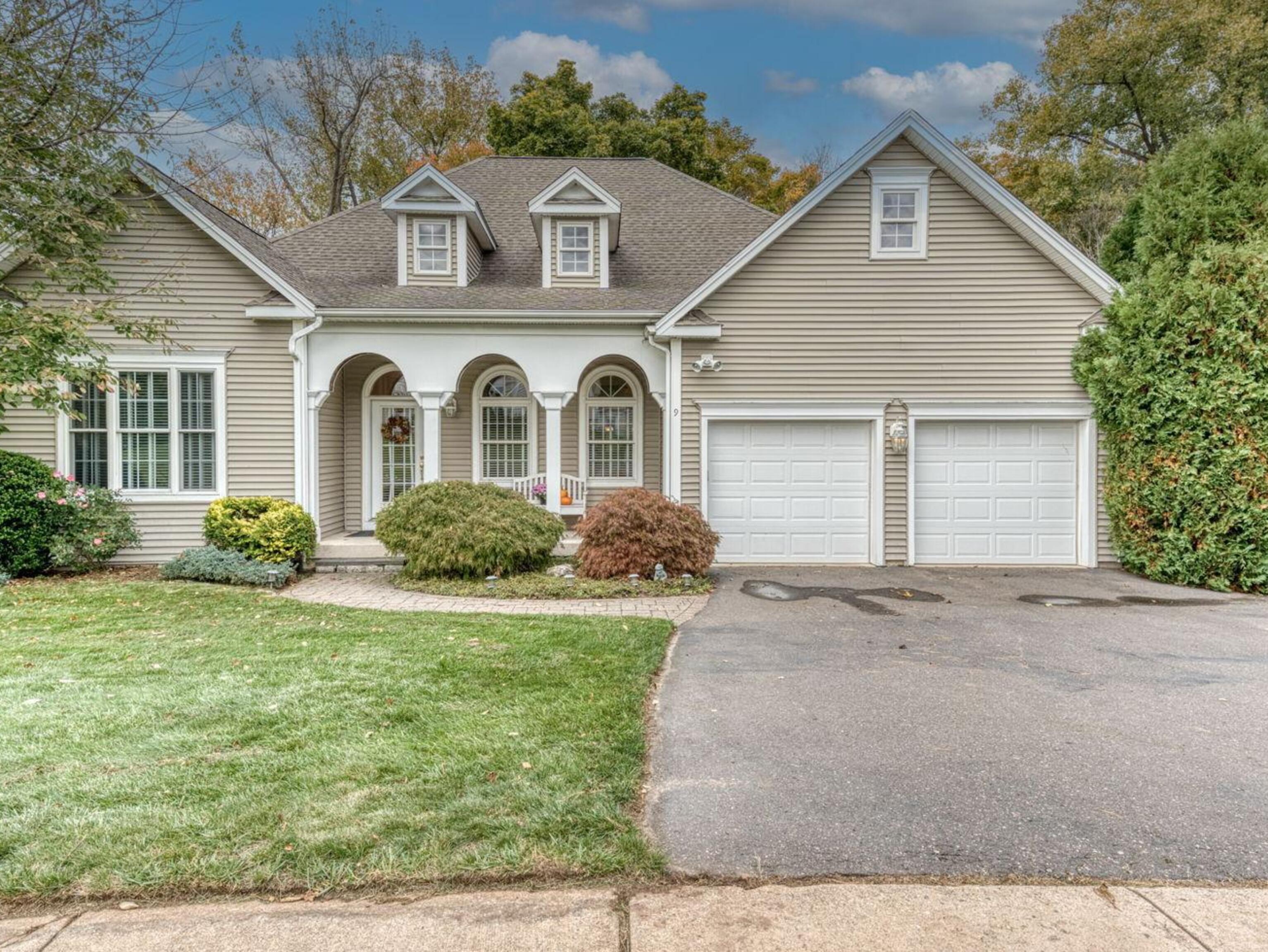 front view of a house with a yard