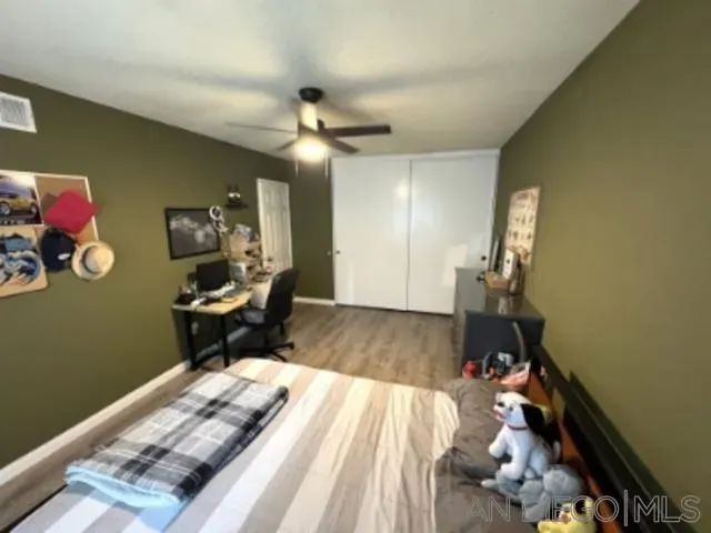 a bedroom with bed and a window